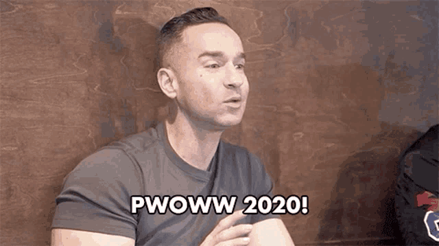 a man is saying pwoww 2020 while sitting in front of a wooden wall .