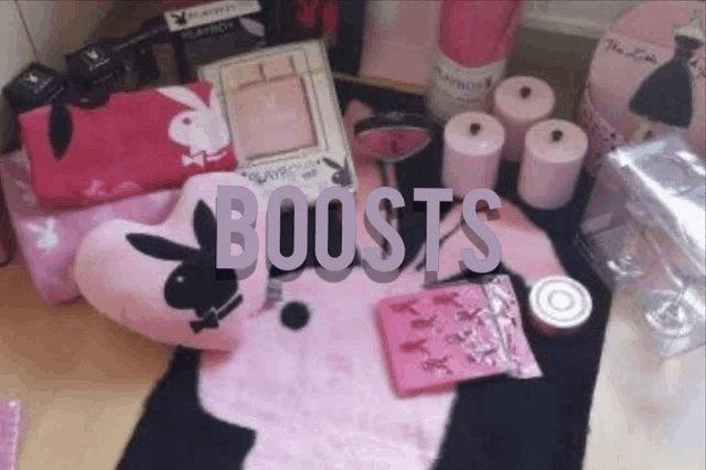 a pink playboy bunny pillow sits on top of a table