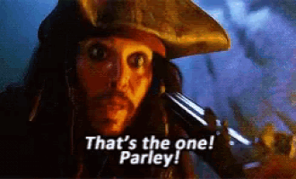 a man in a pirate hat holds a gun and says that 's the one parley