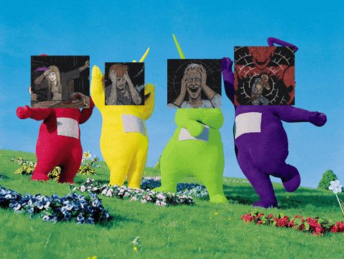 a group of teletubbies are standing in a field