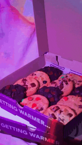 a box of cookies that says getting warmer on the side