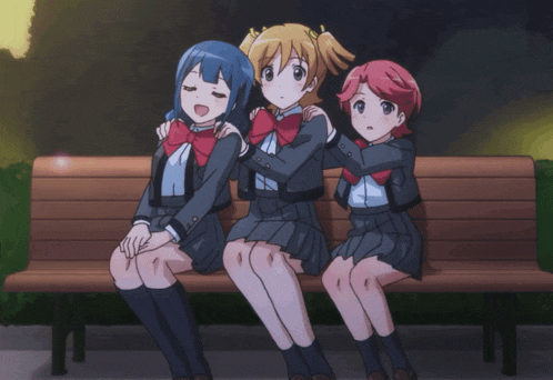 three anime girls are sitting on a bench with one making a funny face