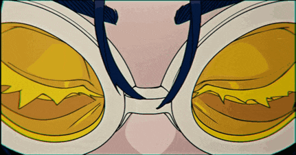a close up of a pair of glasses with a yellow lens