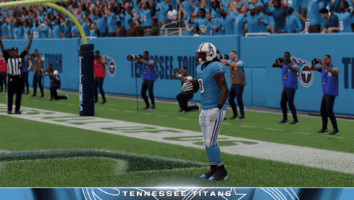 a tennessee titans football player celebrates a touchdown