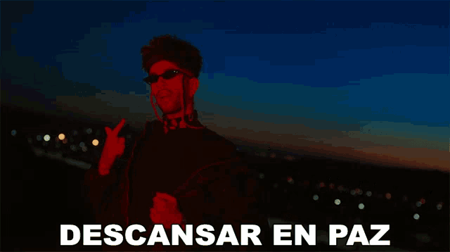a poster with a man in red and the words descansar en paz below him