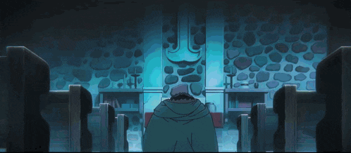 a man is standing in front of a stone wall in a room