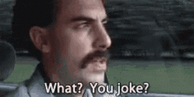 a man with a mustache is asking what ? you joke ? in a car .