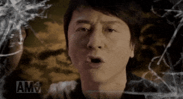 a close up of a man 's face with the letters amv behind him