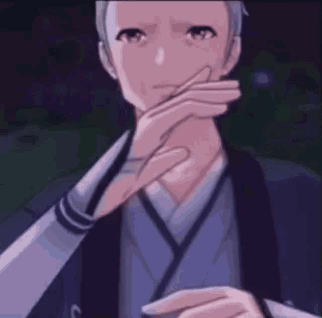 a man in a blue kimono is holding his hand to his chin .