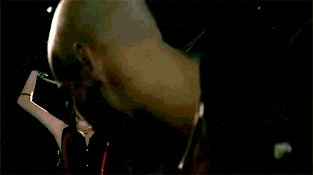 a video game character says " comeo lackey " in a dark room