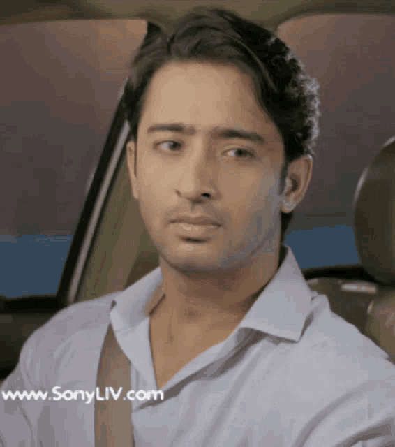 a man sitting in a car with the website www.sonyliv.com on the bottom right