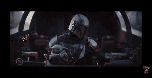 a man in a helmet is holding a baby in his arms with a subscribe button in the corner