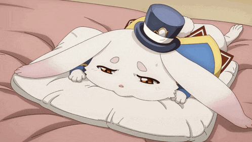 a white rabbit wearing a top hat is laying on a pillow