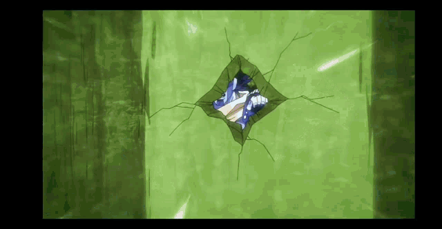 a green wall with a hole in it and a picture of a person coming out of it .