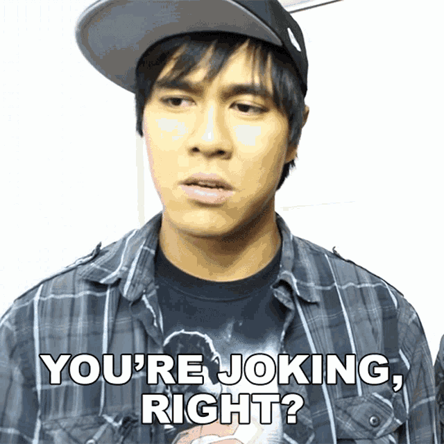 a man wearing a plaid shirt and a baseball cap says you 're joking right