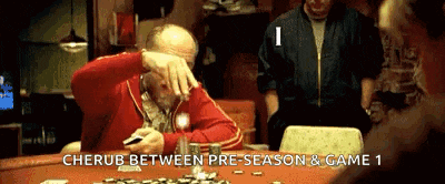 a man sitting at a table with the words cherub between pre-season & game 1 on the bottom