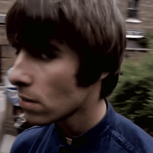 a close up of a man 's face with a blurred background