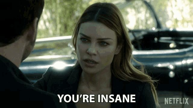 a woman says you 're insane in front of a man