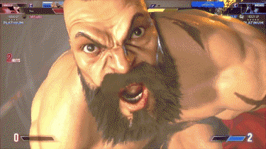 a man with a beard is playing a video game with a score of 2 hits