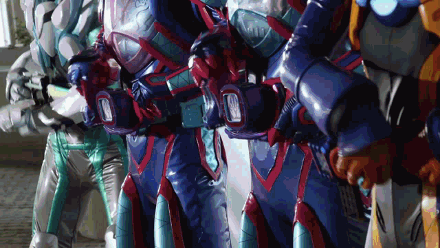 a group of robots are lined up in a row and one of them has a belt that says ' x-men '