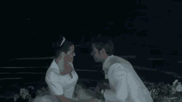 a bride and groom kissing in a boat