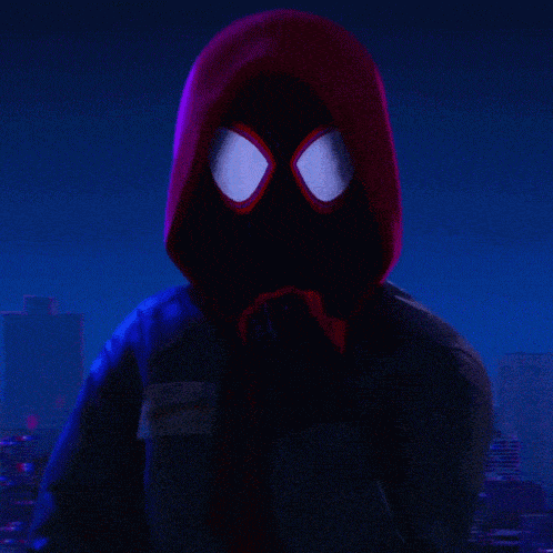 a close up of a person wearing a spider man mask