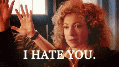 a woman with curly hair is giving a high five with the words i hate you behind her