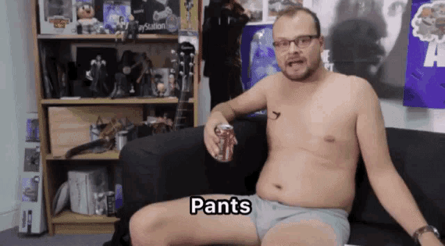 a shirtless man sits on a couch holding a can of soda and the word pants is above him