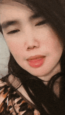 a close up of a woman 's face with the letter i visible