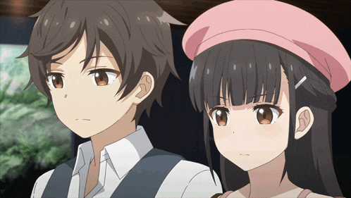 a boy and a girl are looking at each other