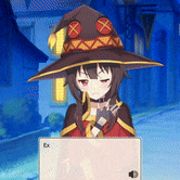 a girl wearing a witch hat is sitting in front of a laptop computer