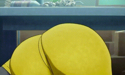 a close up of a person 's butt in a yellow shirt laying under a table .
