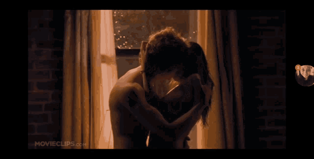 a movie clip of a man and woman kissing