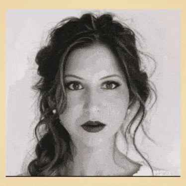 a black and white photo of a woman with red lips