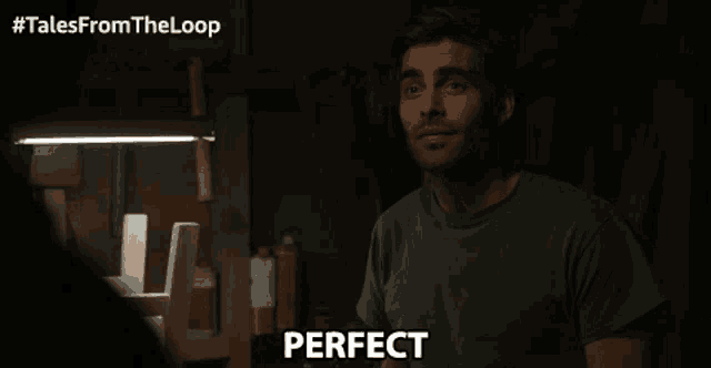 a man in a dark room with the word perfect written on his face