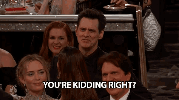 a man sitting in a crowd says " you 're kidding right ? "
