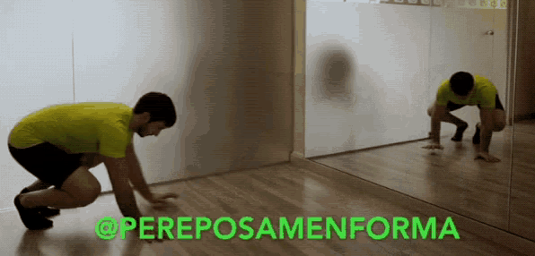 a man in a yellow shirt is doing a handstand in front of a mirror with the words " @pereposamenforma " above him
