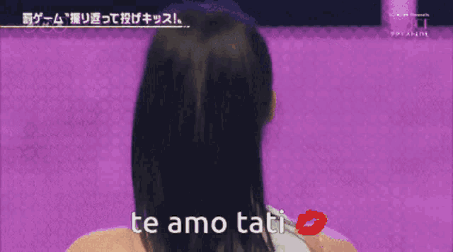 a girl says te amo tati with a red kiss