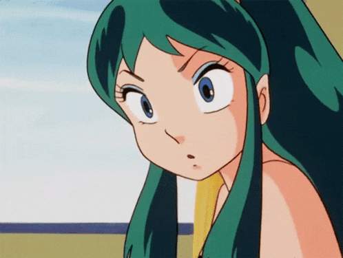 a close up of a cartoon girl with green hair and blue eyes