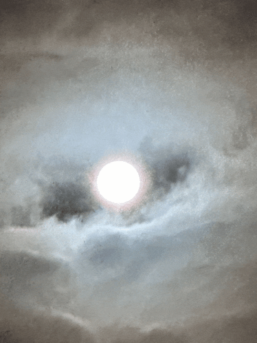 the sun is shining through the clouds in a gray sky