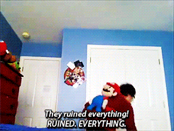 a man holding a mario puppet says they ruined everything and ruined everything