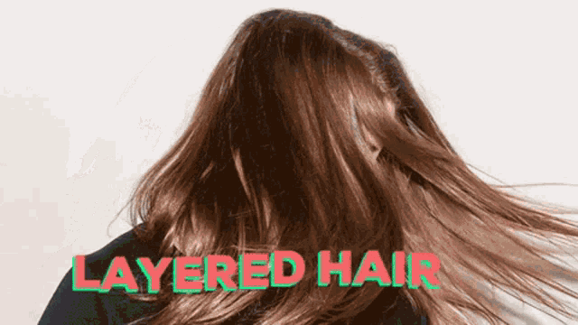a woman 's hair is blowing in the wind with the words layered hair above her