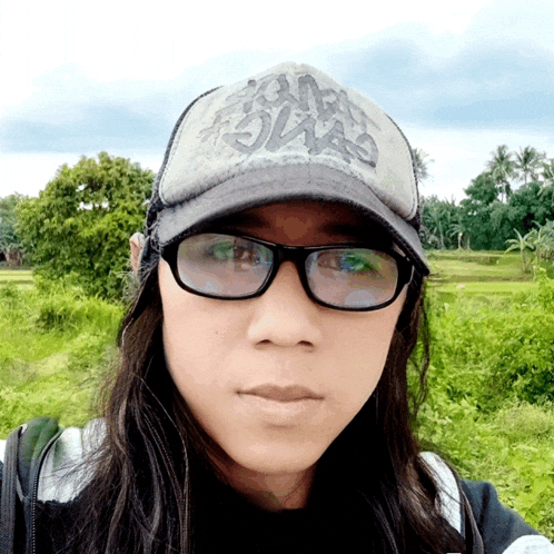 a woman wearing glasses and a hat that says ' swag ' on it