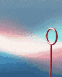 a red object with a circle in the middle against a blue and pink background