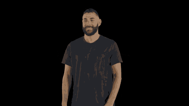 a man with a beard wearing a blue shirt is dancing