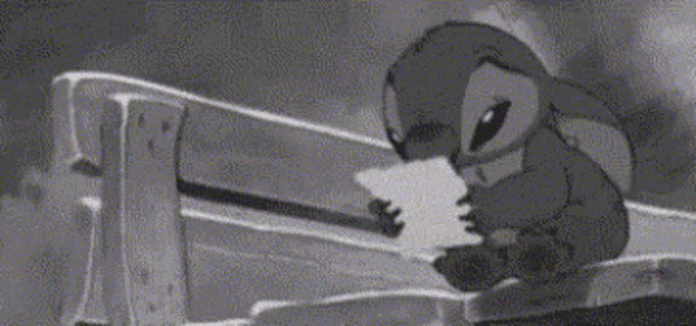 a black and white photo of a cartoon character standing on a fence .