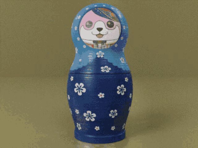 three russian nesting dolls are lined up in a row with flowers on them