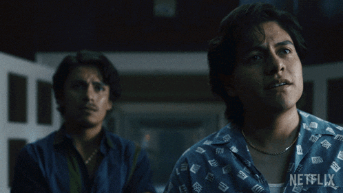 a man in a blue shirt with netflix written on it
