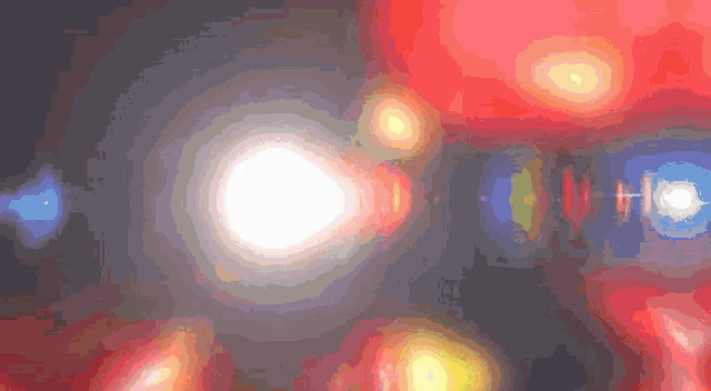 a computer generated image of a glowing object with a blue circle in the middle