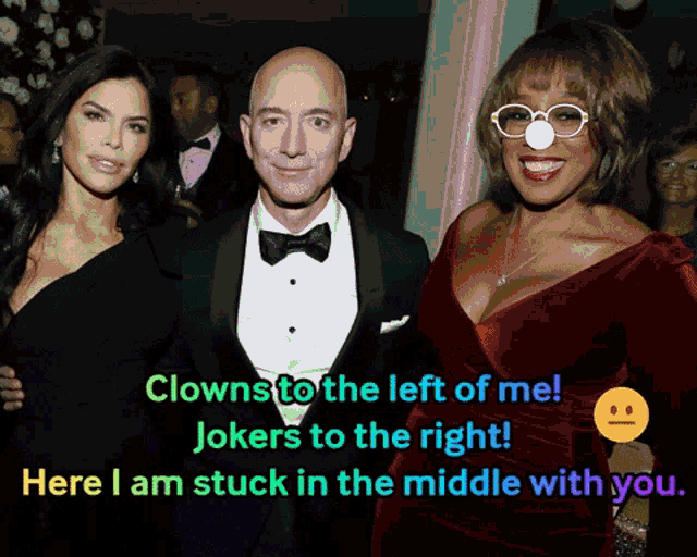 a group of people posing for a picture with the caption clowns to the left of me jokers to the right
